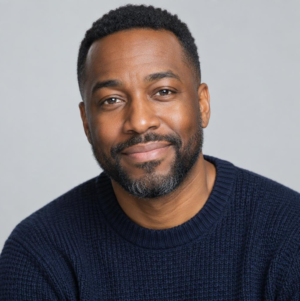 Studio portrait of a Black Canadian man, staff writer and interviewer