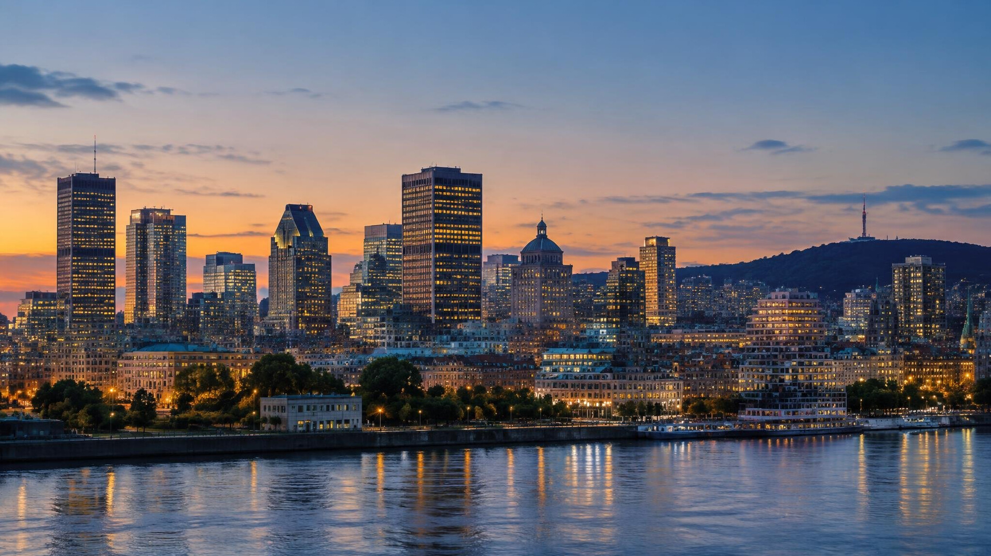 Montreal city skyline at dusk with lit office windows