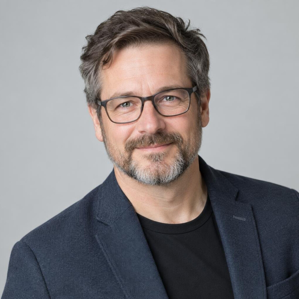 Studio portrait of a white Canadian man, photo editor