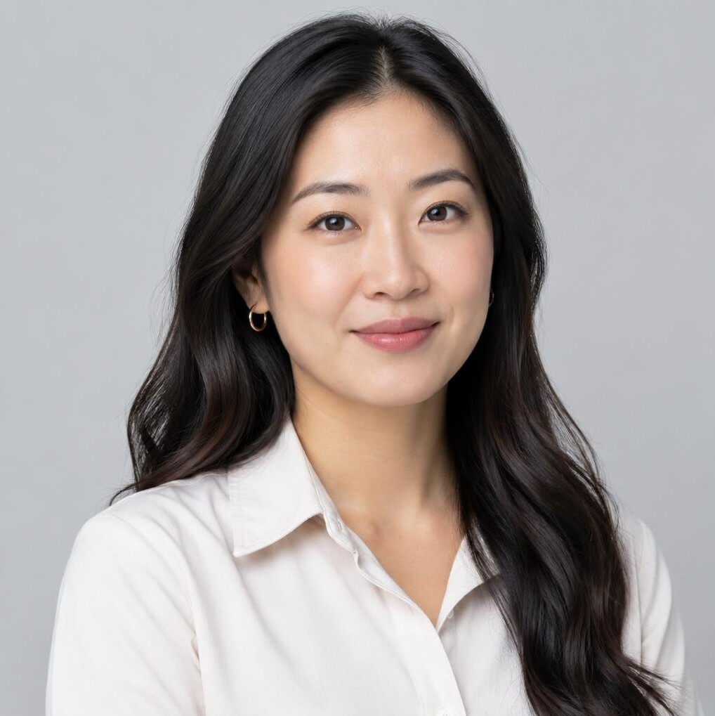 Studio portrait of an East Asian Canadian woman, video producer